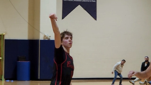 Cornerstone Christian's Quinn Kwasniak watches as a 3-pointer goes in during a win over Andrews Osborne Academe on February 16, 2024.